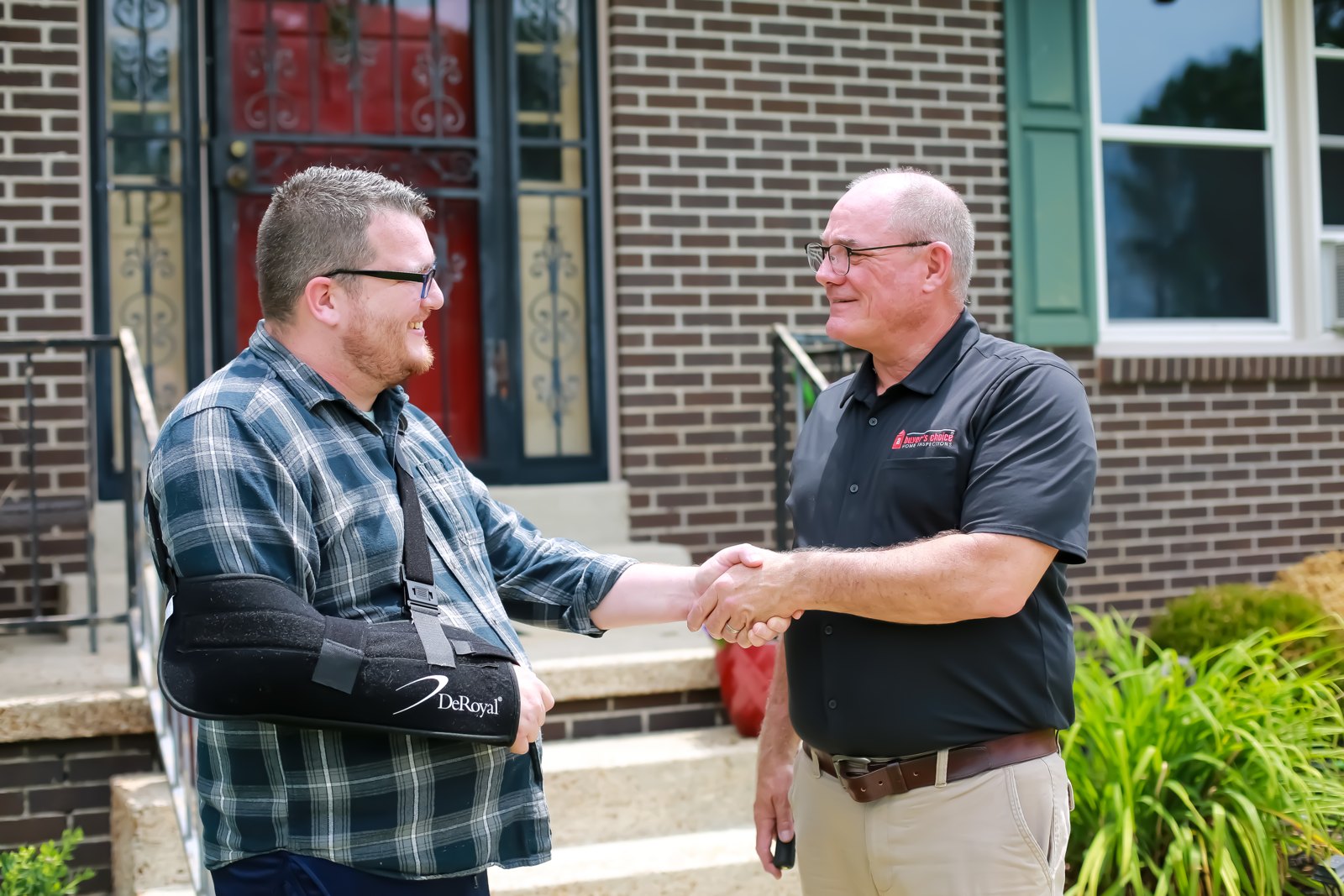 Joseph Caruso greeting a customer in a black ABCHI shirt